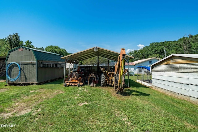 view of yard featuring an outbuilding and a carport