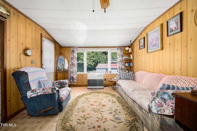 living room with radiator and wood walls