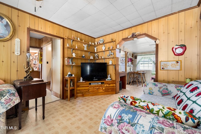 bedroom with wood walls and arched walkways