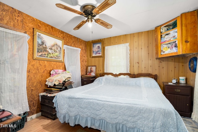 bedroom featuring ceiling fan and wood finished floors