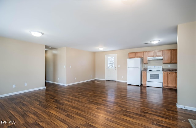 unfurnished living room with baseboards and dark wood finished floors