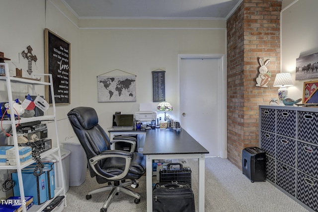 carpeted home office featuring crown molding