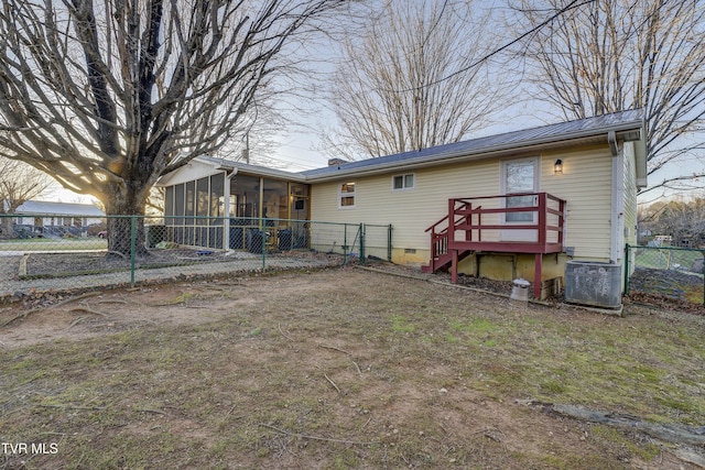 back of house featuring metal roof, central air condition unit, fence, a sunroom, and crawl space