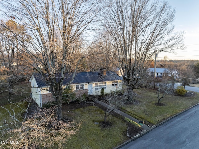 ranch-style house with a front lawn