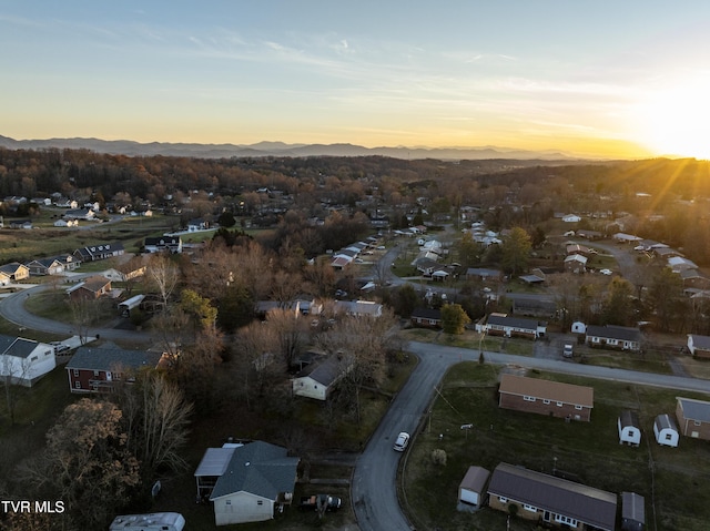 aerial view at dusk with a residential view and a mountain view