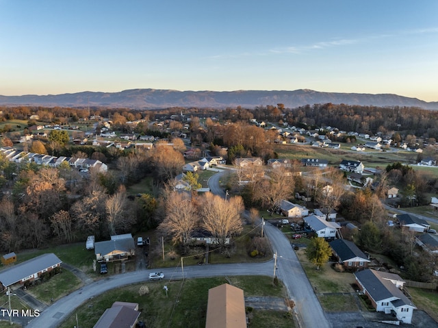 drone / aerial view featuring a residential view and a mountain view