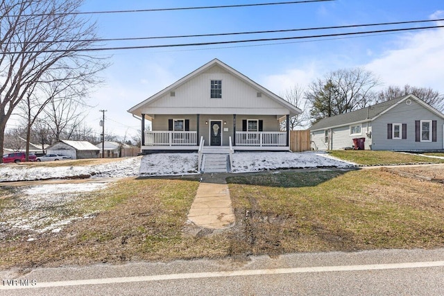 bungalow-style home featuring a porch and a front lawn