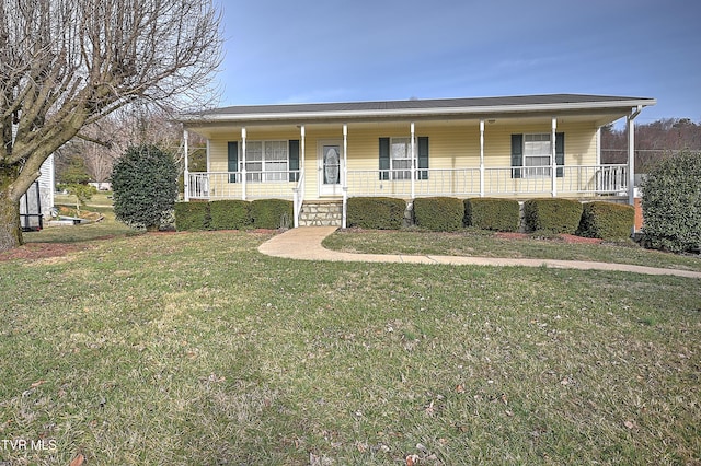 view of front facade with covered porch and a front lawn