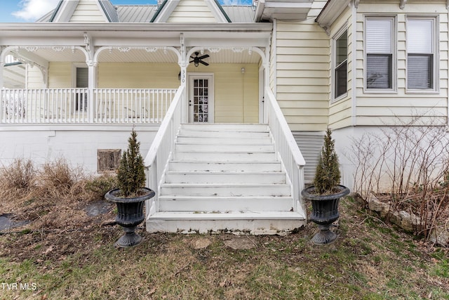 property entrance with metal roof and a porch