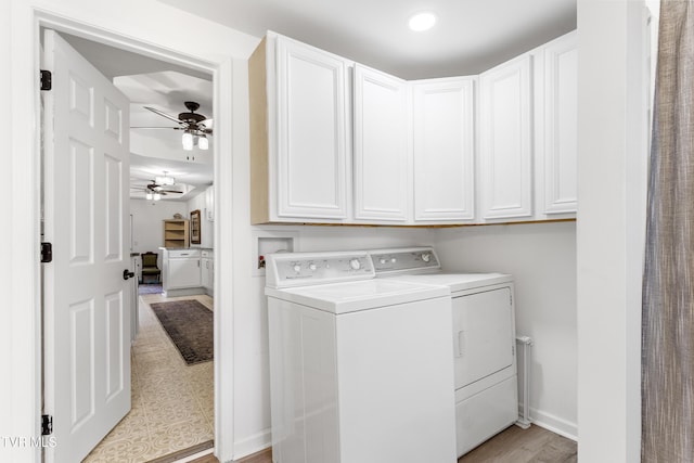 laundry area with a ceiling fan, washer and clothes dryer, cabinet space, and baseboards