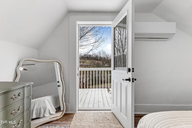 bedroom with lofted ceiling, access to outside, dark wood-type flooring, and a wall mounted AC