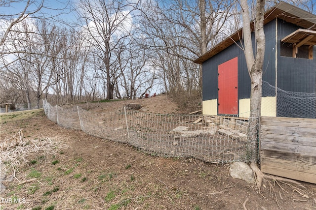 view of yard with an outbuilding and a shed