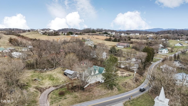 drone / aerial view featuring a mountain view