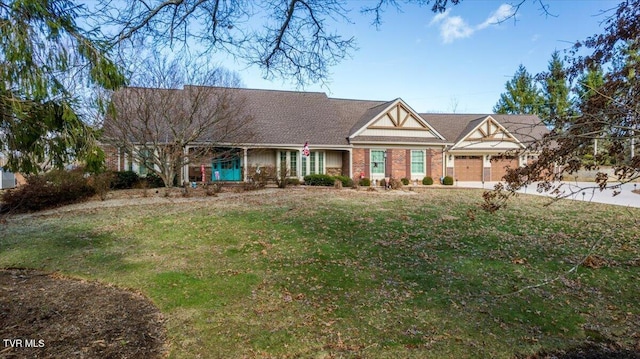 view of front of house with brick siding and a front yard