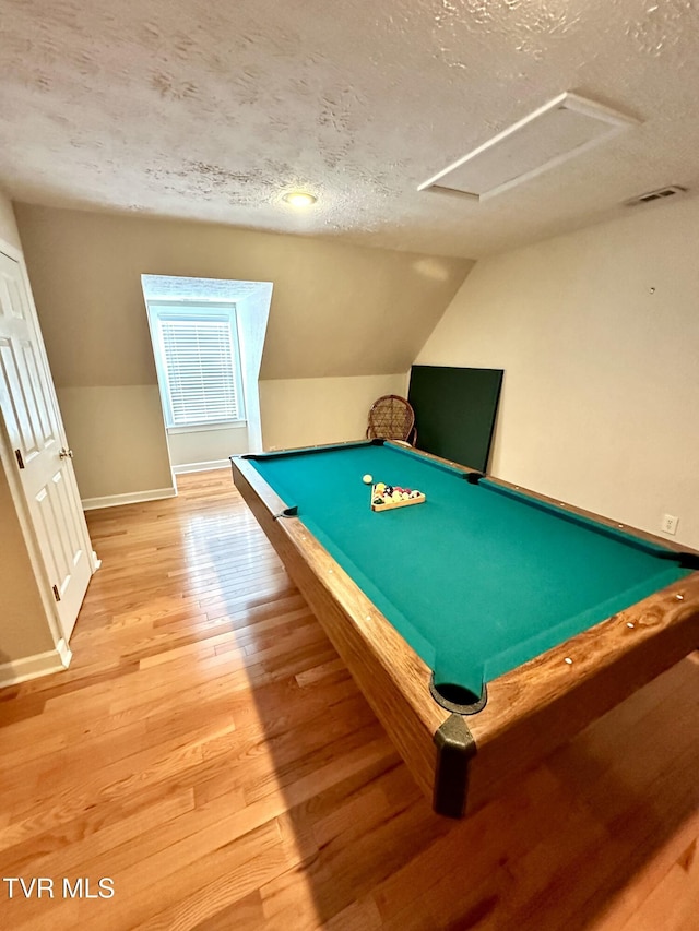 recreation room with baseboards, lofted ceiling, pool table, a textured ceiling, and light wood-type flooring