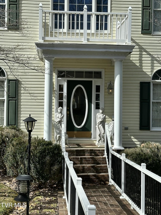 property entrance with a balcony