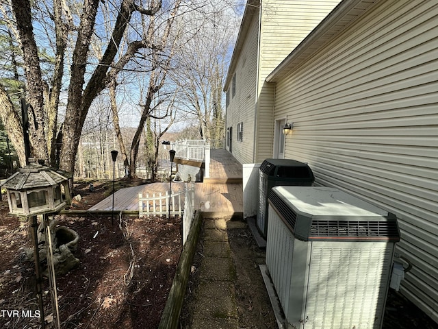 view of side of home featuring central air condition unit