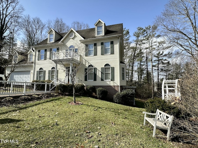 view of front of property with a front yard, fence, and a balcony