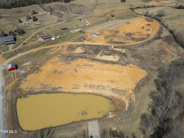 birds eye view of property with a rural view