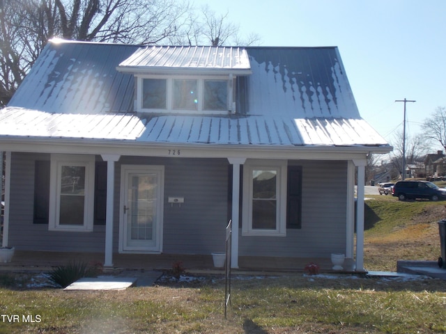 view of front of home featuring metal roof and a standing seam roof