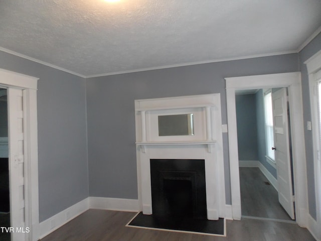 unfurnished living room featuring dark wood-style floors, a fireplace with flush hearth, baseboards, and a textured ceiling