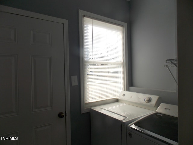 clothes washing area with laundry area and separate washer and dryer