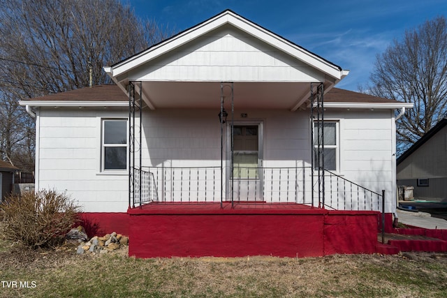 rear view of house with covered porch