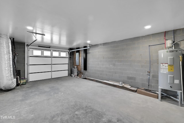 garage with concrete block wall and water heater