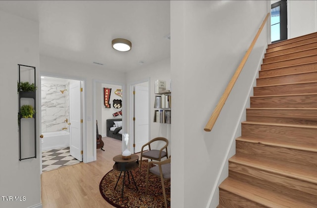 stairs with wood finished floors