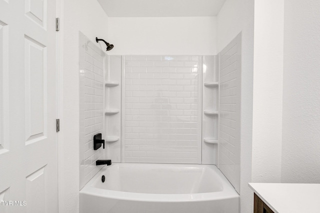 bathroom featuring bathtub / shower combination and vanity