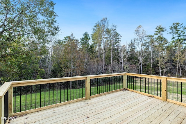 wooden deck with a yard