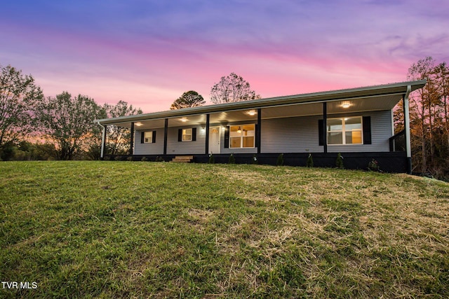 view of front of home with a lawn