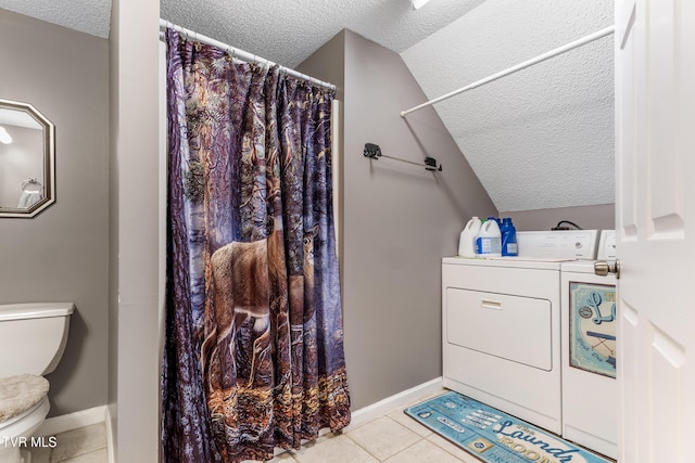 full bath with toilet, separate washer and dryer, a textured ceiling, and tile patterned floors