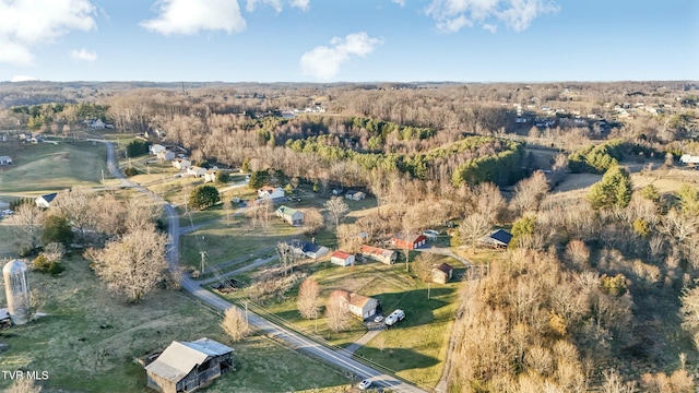 aerial view featuring a forest view and a rural view