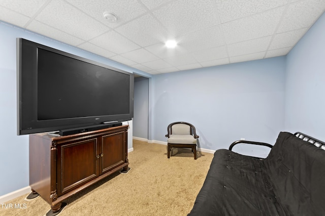 sitting room with light carpet, baseboards, and a drop ceiling