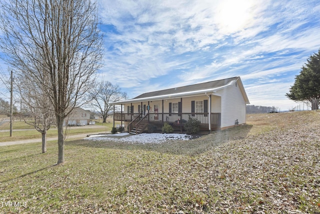 view of front of property with covered porch and a front lawn