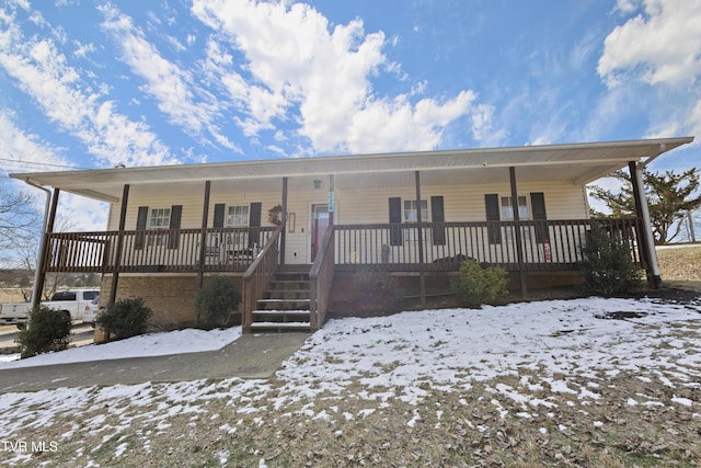 view of front of house with a porch and stairs