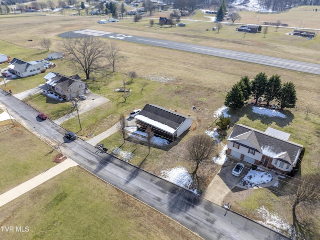 birds eye view of property with a rural view