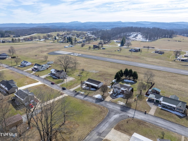 birds eye view of property featuring a mountain view