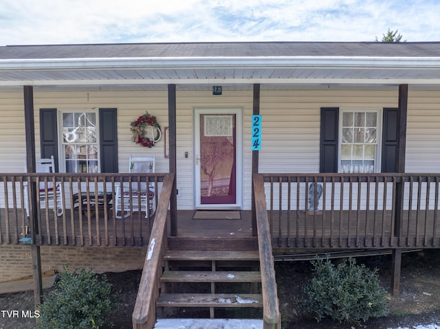 doorway to property featuring a porch