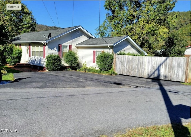 view of side of home with fence