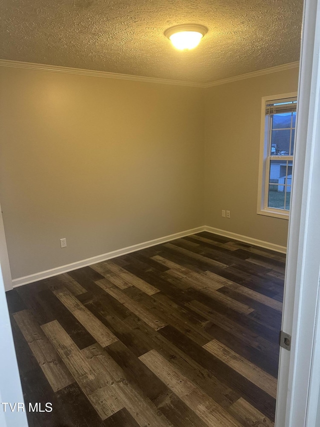 unfurnished room featuring a textured ceiling, baseboards, dark wood finished floors, and crown molding