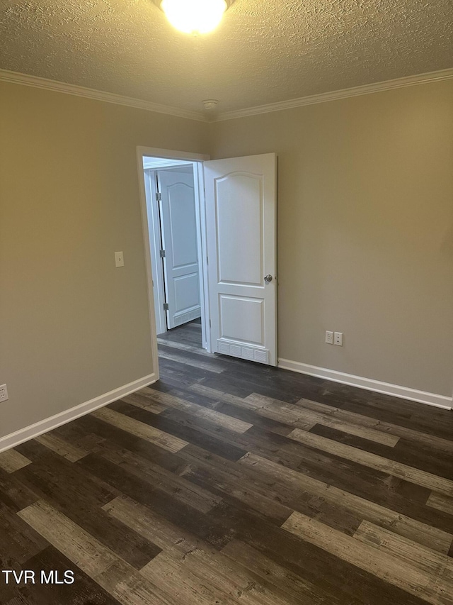 unfurnished room featuring dark wood-style floors and crown molding