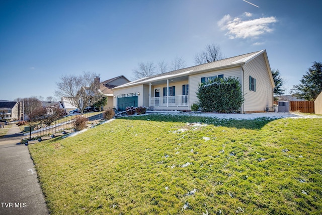 ranch-style house featuring a porch, fence, and a front lawn