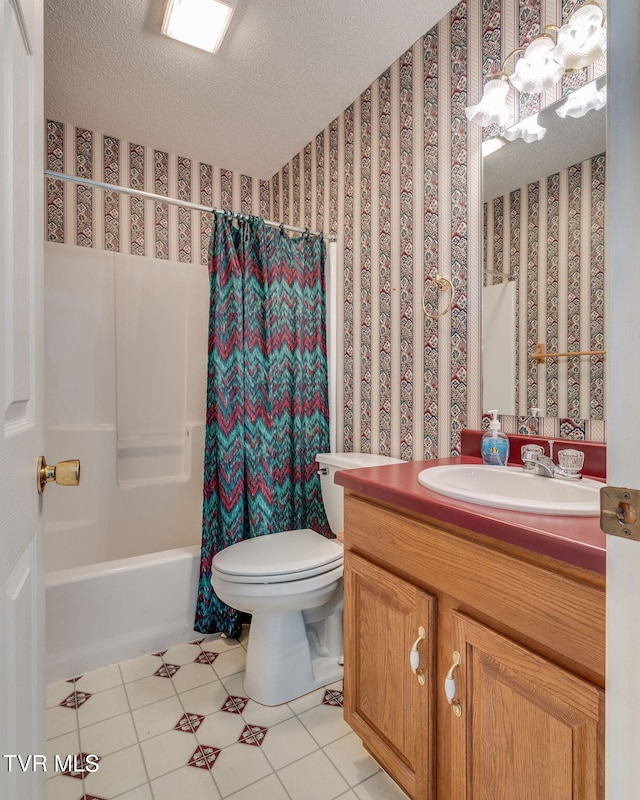 bathroom featuring shower / tub combo, tile patterned flooring, a textured ceiling, and vanity