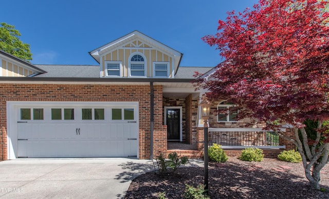 view of front of home with brick siding, a porch, concrete driveway, and roof with shingles