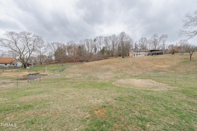 view of yard featuring a rural view and fence