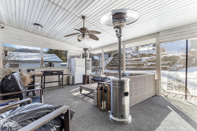 snow covered patio featuring a ceiling fan