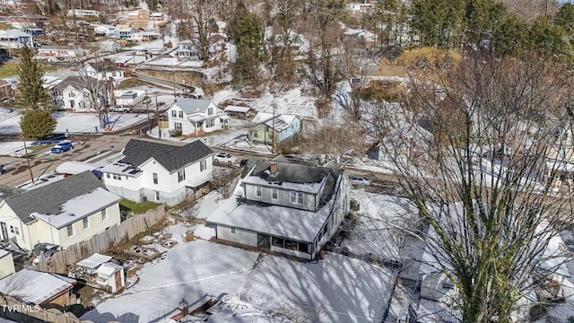 snowy aerial view with a residential view