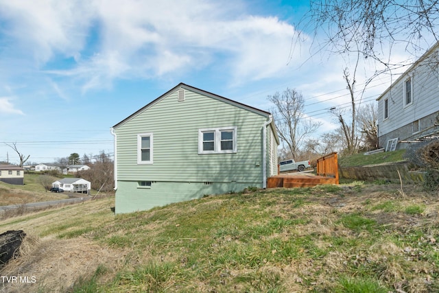 view of side of home featuring a wooden deck